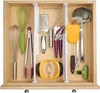 A drawer filled with various kitchen utensils organized with dividers. Produktbild-Vorschau