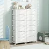 A white multi-drawer storage cabinet with toys on top, in a room with a blue chair and a storage bin. Náhled obrázku produktu