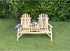 A wooden bench with an integrated table sits on a grassy lawn in a garden setting, with trees and foliage in the background. Produktbild-Vorschau