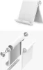 A white tablet stand is shown from two angles, one assembled and one exploded view. Náhľad obrázku produktu