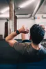 A man is doing sit-ups in a gym, wearing a smartwatch. Náhľad obrázku produktu