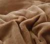A close-up view of a soft, textured brown fabric, likely a blanket or comforter, showing its plush surface and folds. Produktbild-Vorschau