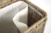 A close-up view of the interior of a wicker laundry basket, showing its white fabric lining. Podgląd zdjęcia produktu