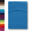 A folded fitted sheet in royal blue is shown on a white background, with a column of other color swatches to the left. Produktbild-Vorschau