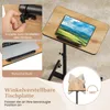 A close-up view of a portable table with a laptop and tablet on it, highlighting adjustable features. Podgląd zdjęcia produktu