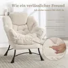 A plush, beige corduroy armchair is shown in a room setting, with a close-up inset highlighting the texture and softness of the cushion. Text overlays describe the comfort and support of the chair. Produktbild-Vorschau