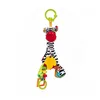 A stuffed zebra toy with various attached sensory elements, hanging from a green ring. Podgląd zdjęcia produktu