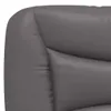 Close-up view of the corner of a gray upholstered furniture item, likely a bed frame or sofa. Produktbild-Vorschau