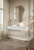 A modern console table with a unique mirror above it, set in a well-lit room with elegant wall paneling and sheer curtains. Voir les images du produit