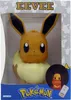 The image shows a product box for a Pokemon Eevee LED lamp. The box is mostly white with gray accents and features the Pokemon logo and the name 'EEVEE' in large letters. Náhľad obrázku produktu