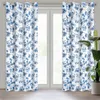Two floral patterned curtains hanging on a window. Anteprima dell’immagine prodotto