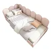 A child's bed with various pillows and blankets. Náhled obrázku produktu