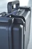 A close-up of the latch and handle of a black case. Produktbild-Vorschau