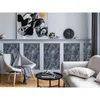 A living room setting with furniture and wall art. Produktbild-Vorschau
