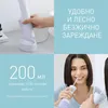 A collage showing a white water flosser being charged, its features described in text, and a woman using it. Produktbild-Vorschau
