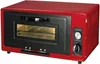 A red camping gas oven is shown against a white background. Voir les images du produit