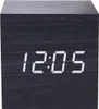 A close-up of a black digital alarm clock displaying the time. Produktbild-Vorschau