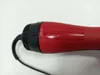 A close-up shot of the handle and switch of a red and black hairdryer. Voir les images du produit