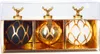 A set of three glass Christmas ornaments in a clear plastic box with a gold insert. Podgląd zdjęcia produktu