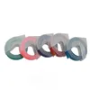 Five rolls of colored embossing tape are arranged in a row against a white background. Voir les images du produit