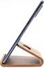 A smartphone is placed on a wooden stand against a white background. Podgląd zdjęcia produktu