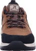 A close-up, front-facing view of a brown and black sneaker. Voir les images du produit