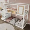 A white bunk bed with a staircase and a small fence on the top bunk, set in a child's bedroom. Produktbild-Vorschau