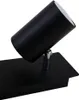 A close-up studio shot of a black ceiling spotlight with a silver joint. Produktbild-Vorschau