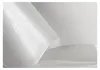A close-up, abstract view of white paper or fabric with a textured pattern. Produktbild-Vorschau