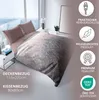 A bedroom scene with a bed made up with a duvet and pillows, featuring a large window with a view. Produktbild-Vorschau