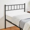 A black metal bed frame with a headboard and a mattress with bedding. Podgląd zdjęcia produktu