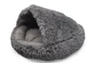 A fluffy, dark gray pet bed with a hooded opening. Produktbild-Vorschau