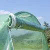 A close-up view of a rolled-up flap on a green greenhouse cover, showing a zipper and mesh material. Anteprima dell’immagine prodotto