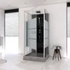A modern bathroom with a large glass shower enclosure. Produktbild-Vorschau