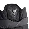 A close-up view of the upper part of a black hockey pant, showing padding and a logo. Náhled obrázku produktu