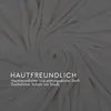 A close-up, swirled view of a soft, off-white fabric, likely a blanket or throw, with text overlay. Produktbild-Vorschau