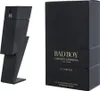 A black perfume bottle and its packaging are displayed side-by-side against a white background. Anteprima dell’immagine prodotto