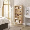 A bedroom scene with a bookshelf filled with decorative items and storage boxes, next to a bed and a dressing table. Produktbild-Vorschau
