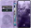 A phone case with a phone inside, and some cards and money inserted into the case. Produktbild-Vorschau