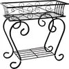 A black metal plant stand with a rectangular planter basket on top and a lower shelf. Produktbild-Vorschau