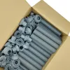 A cardboard box filled with grey plastic pipes and connectors. Produktbild-Vorschau