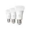 Three white Philips Hue light bulbs are arranged diagonally on a white background. Produktbild-Vorschau