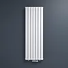 A white vertical radiator is mounted on a dark gray wall. Produktbild-Vorschau