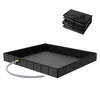 A black foldable shower tray with a grey drain hose is shown on a white background. A folded shower tray is also visible in the top right corner. Produktbild-Vorschau