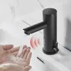 Hands being washed under a black automatic faucet in a modern bathroom sink. Produktbild-Vorschau