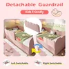 A pink upholstered bed with a scalloped design, shown with a detachable guardrail in two positions. Produktbild-Vorschau