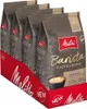 A display of multiple bags of Melitta Barista Caffè Crema coffee beans, presented in a red cardboard display box. Produktbild-Vorschau