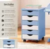 A blue and white roll container with drawers, next to a desk, with product features listed on the left. Produktbild-Vorschau