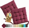 Two burgundy seat cushions are shown on a white background, with a tag indicating a set of two.