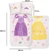 A flat lay of a Disney Princess themed children's bedding set, showing two pillowcases and a duvet cover with princess dress designs. Dimensions are indicated with measurement lines and text. Podgląd zdjęcia produktu